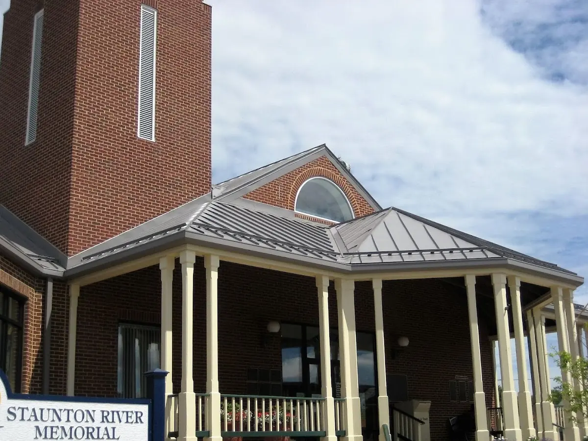 Skilled roofing craftsmen working on a residential roof in Delphi Falls